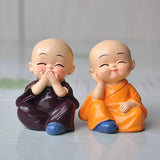 Load image into Gallery viewer, Webelkart Premium Buddha Child Monk Set of 4 Statue Figurines Home Decor,Buddha Showpiece for Home Decor, Car Dashboard,Table Top Decoration Item for Home