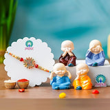 Load image into Gallery viewer, Webelkart Premium Rakhi for Brother with Gift - Set of 1 Designer Rakhi With Set of 4 Miniature Buddha Monk Figurines Showpiece For Home With Chawal And Greeting Card