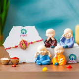 Load image into Gallery viewer, Webelkart Krishna Designer Rakhi for Brother with Gift - Set of 1 Rakhi With Set of 4 Miniature Buddha Monk Figurines Showpiece For Home With Chawal And Greeting Card