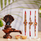 Load image into Gallery viewer, Webelkart Cobmo Of 3 Rakhi For Bhaiya Bhabhi With Shivling Statue Idol, Mahadev Murti for Home Decor | Rakhi For Brother And Bhabhi | Rakhi For Kids | Lumba Rakhi With Roli Chawal Wishes Card