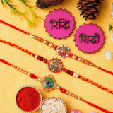 Load image into Gallery viewer, Webelkart Set Of 3 Rakhi For Brother And Bhabhi With Riddhi-Siddhi Sticker for Home Decor | Rakhi For Bhaiya Bhabhi |Lumba Rakhi For Bhabhi |Kids Rakhi With Roli Chawal Best Wishes Card