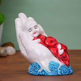 Load image into Gallery viewer, Webelkart Premium Cute Child Monk Sleeping on Palm Showpiece - 12 cm (Polyresin, Multi)- for Home Decor| Office Decor| Valentines Day Gifts | Diwali Decor| Vaastu Decor| Fengshui
