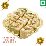 Load image into Gallery viewer, Webelkart Bhaiya Bhabhi Rakhi Set with Sweet Gift - Premium Lumba Rakhi with Green Lord Gautam Buddha Idol, 450 Grams Soan Papdi Sweet Gift Pack and Roli Chawal