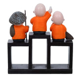 गैलरी व्यूवर में इमेज लोड करें, Webelkart Premium Set of 3 Child Monk Showpiece for Home and Office Decor| Child Monk Showpiece for Gift| Showpiece for Car Dashboard (Polyresin,Orange)